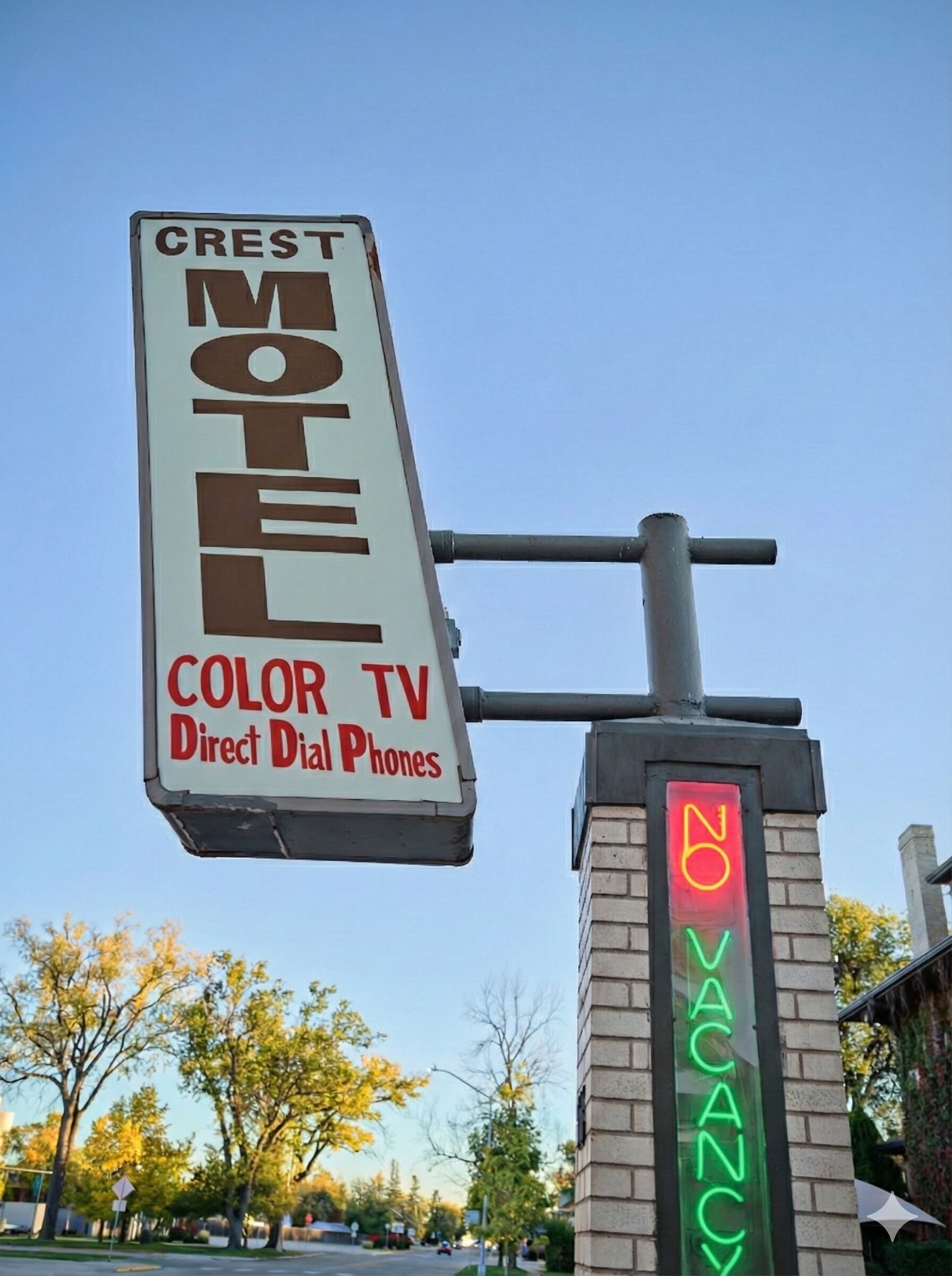 A motel sign with "Crest Motel" and "Color TV Direct Dial Phones" advertised.