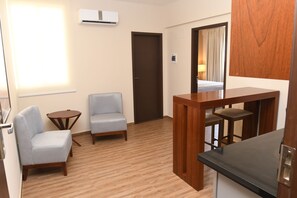 Apartment, 1 Queen Bed | Living area | Flat-screen TV - Taos Apart Hotel (Santa Cruz)