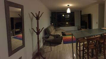 Family Apartment, Multiple Beds, Beach View | Living area | Flat-screen TV