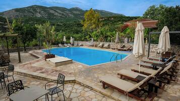 Seasonal outdoor pool, pool umbrellas