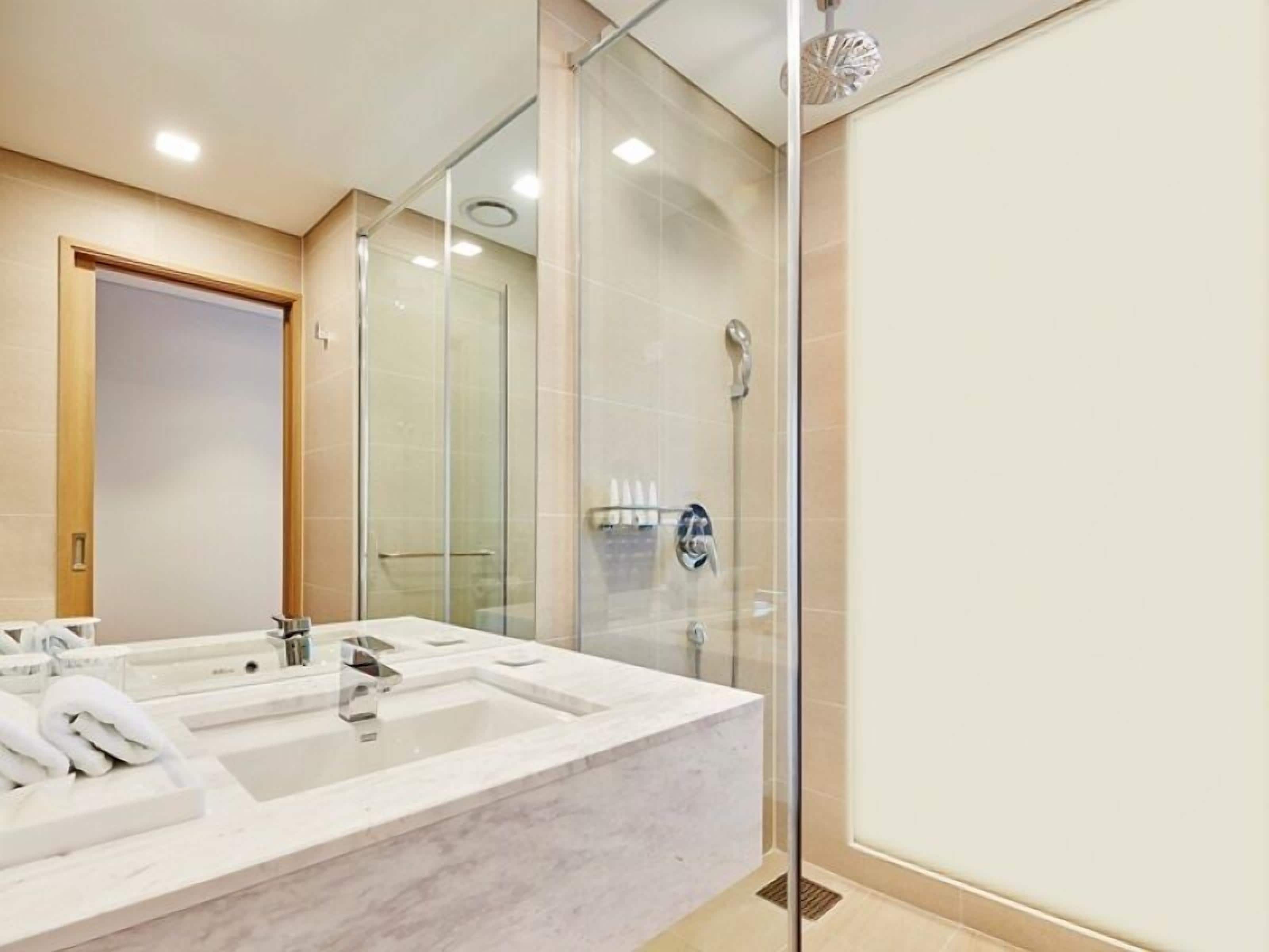 shower, hair dryer, bathrobes, slippers