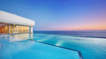 Indoor pool, outdoor pool, open 7:00 AM to 10:00 PM, pool umbrellas
