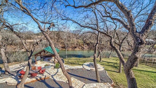 A park with a gazebo, stone pathways, and a pond. - Players Place PRD2462 (New Braunfels)