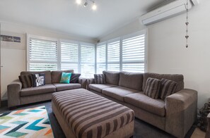 3-Bedroom House (1 King, 1 Queen, 1 Tri-Bunk) | Living area | Flat-screen TV - Villa Of Rye (Rye)