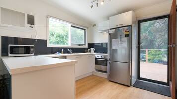 3-Bedroom House (1 King, 1 Queen, 1 Tri-Bunk) | Private kitchen | Full-sized fridge, microwave, oven, stovetop