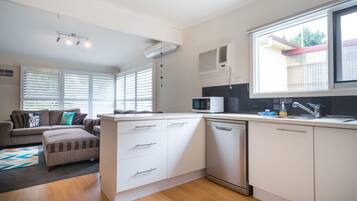 3-Bedroom House (1 King, 1 Queen, 1 Tri-Bunk) | Private kitchen | Full-sized fridge, microwave, oven, stovetop