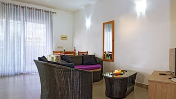 Deluxe Apartment, 2 Bedrooms | Living area | 32-inch flat-screen TV with digital channels, TV
