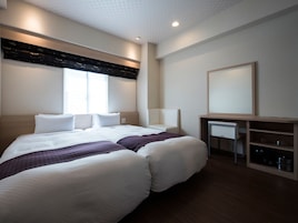 Down comforters, blackout drapes, WiFi (free), bed sheets