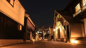 A narrow street lined with traditional buildings at night. - Nagasaki Bus Terminal Hotel (Nagasaki)