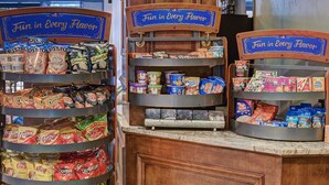 A snack display with various chips and cereals.