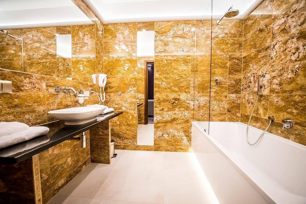 junior studio suite | bathroom | free toiletries, hair dryer, slippers, towels