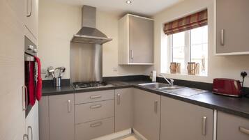 Apartment | Private kitchen | Fridge, microwave, stovetop, coffee/tea maker
