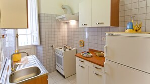 Apartment, 3 Bedrooms | Private kitchen | Full-sized fridge, oven, stovetop, espresso maker - Rental in Rome Sardegna (Rome)