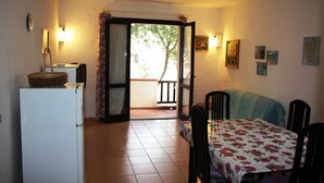 Apartment, 1 Bedroom | Living area - Residence Itaca (Santa Teresa di Gallura)