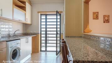 Apartment, 2 Bedrooms, Balcony | Private kitchenette | Fridge, microwave, oven, stovetop