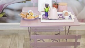 A small table with a tray of pastries, a teapot, a cup, and a small potted plant. -  ORCHIDEA HOUSE FIUMICINO two (Fiumicino)