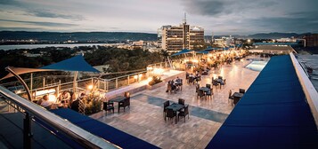 Outdoor pool, open 8 AM to 6 PM, pool umbrellas, sun loungers