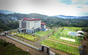A large hotel with multiple floors, a swimming pool, and well-maintained gardens. - The Grand Mountain Hotel (Matale)