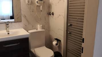 Shower, free toiletries, hair dryer, slippers