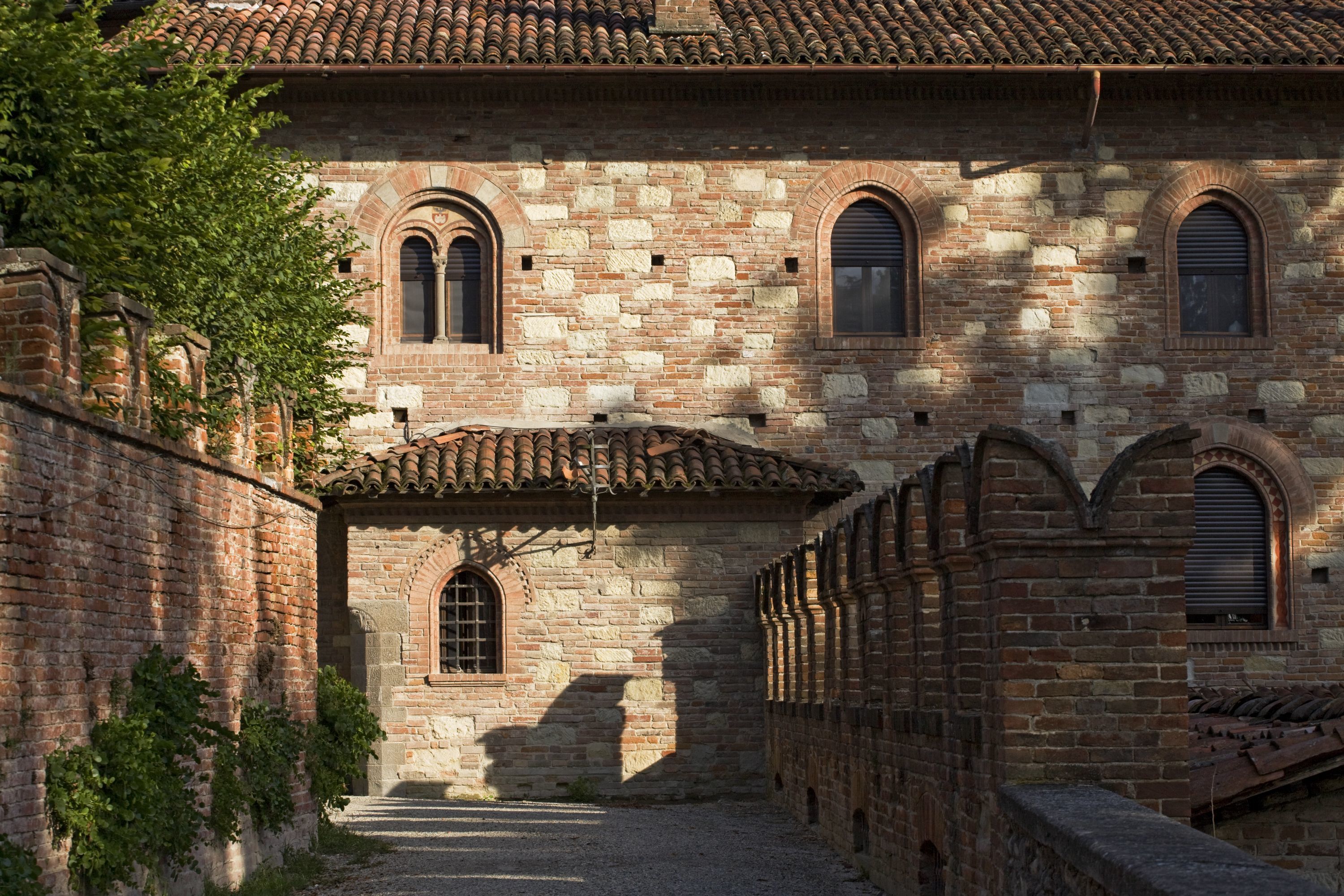 A historic building with arched windows and a stone facade.