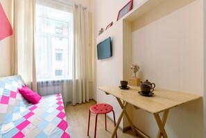Standard Studio | Living area | 24-inch flat-screen TV with cable channels, TV