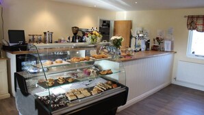 A breakfast buffet with various pastries and baked goods. - Alexander Park Resort (Ledbury)