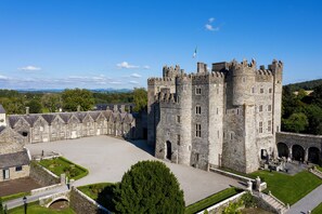 A large stone castle with multiple towers and a central courtyard. - Kilkea Castle (Kilkea)
