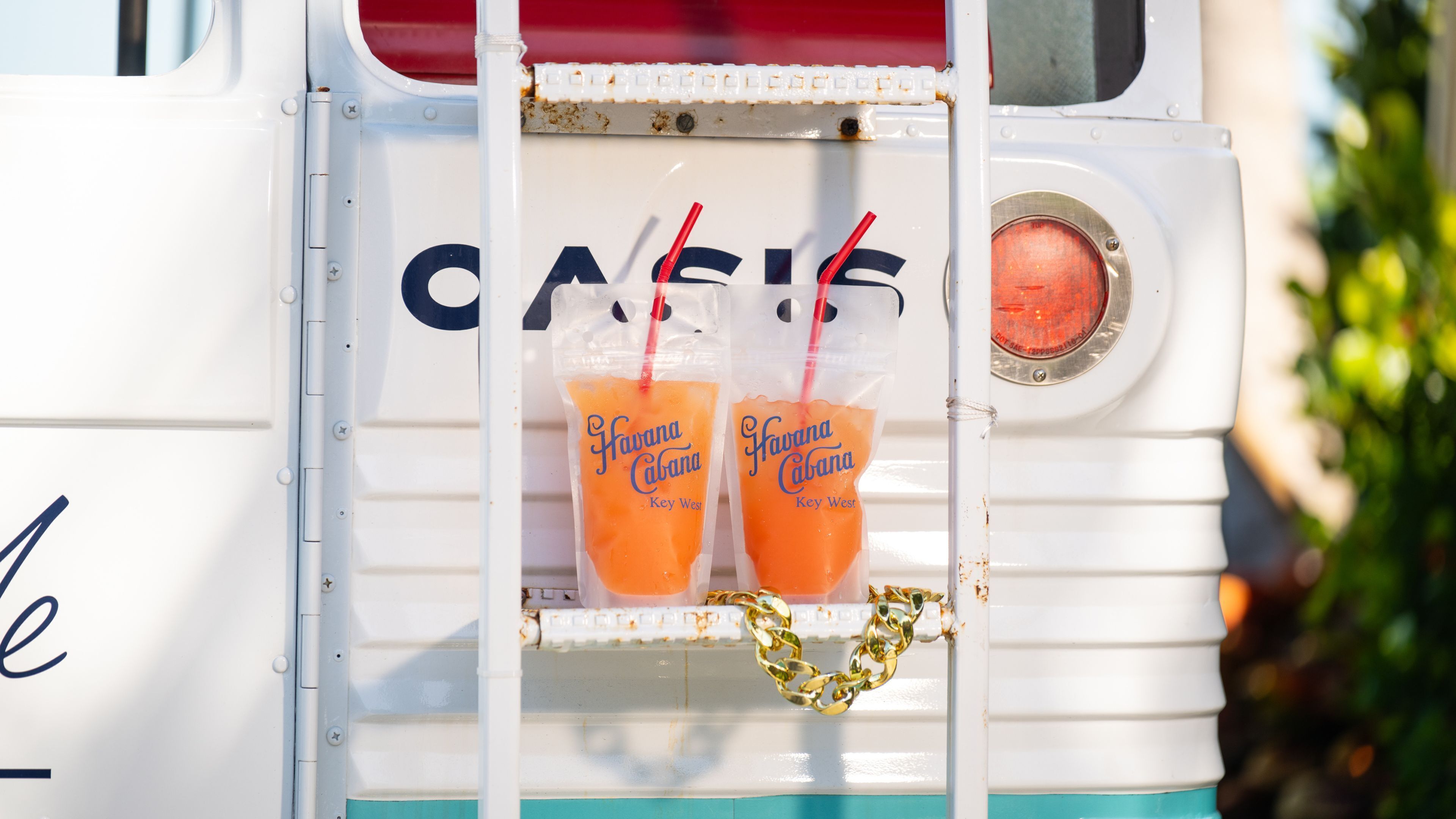 A vintage bus with two drinks labeled "Havana Cabana" in a compartment.