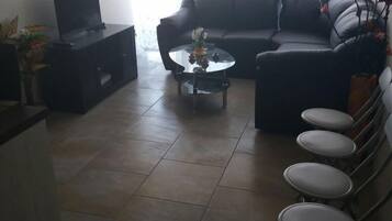 Family Apartment, 2 Bedrooms | Living room | Flat-screen TV
