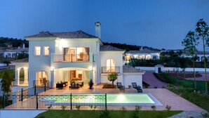 A two-story house with a swimming pool, outdoor seating, and a well-maintained garden. - Arcos Gardens Sol Rent Golf (Arcos de la Frontera)
