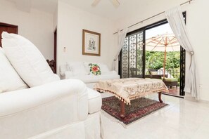 Deluxe House, 2 Bedrooms | Living room | Flat-screen TV, DVD player