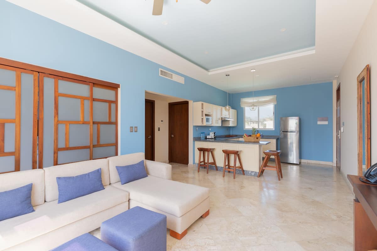 junior suite, 2 bedrooms, city view | living area | 49-inch smart tv with cable channels, tv, ipod dock