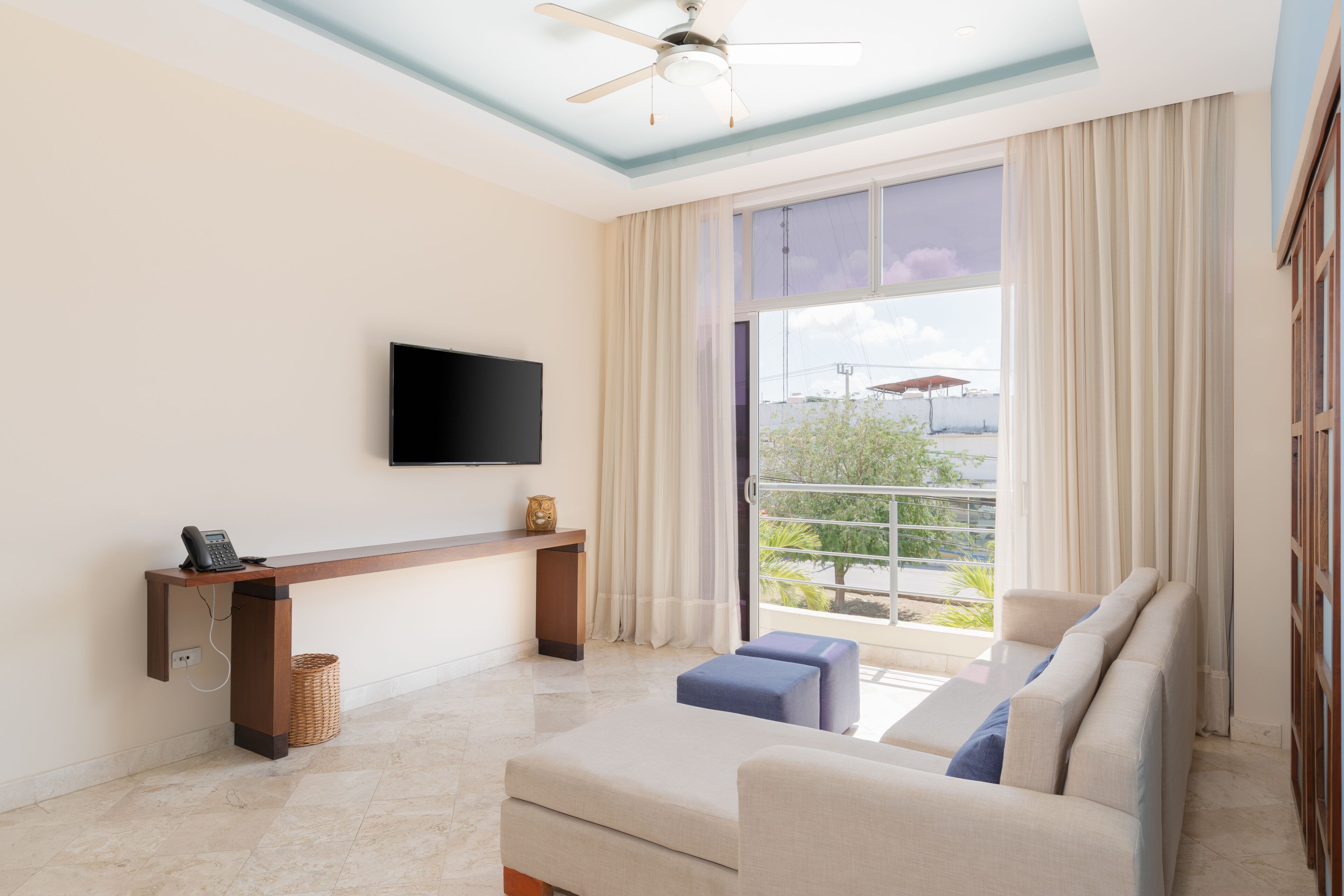 junior suite, 2 bedrooms, city view | living area | 49-inch smart tv with cable channels, tv, ipod dock