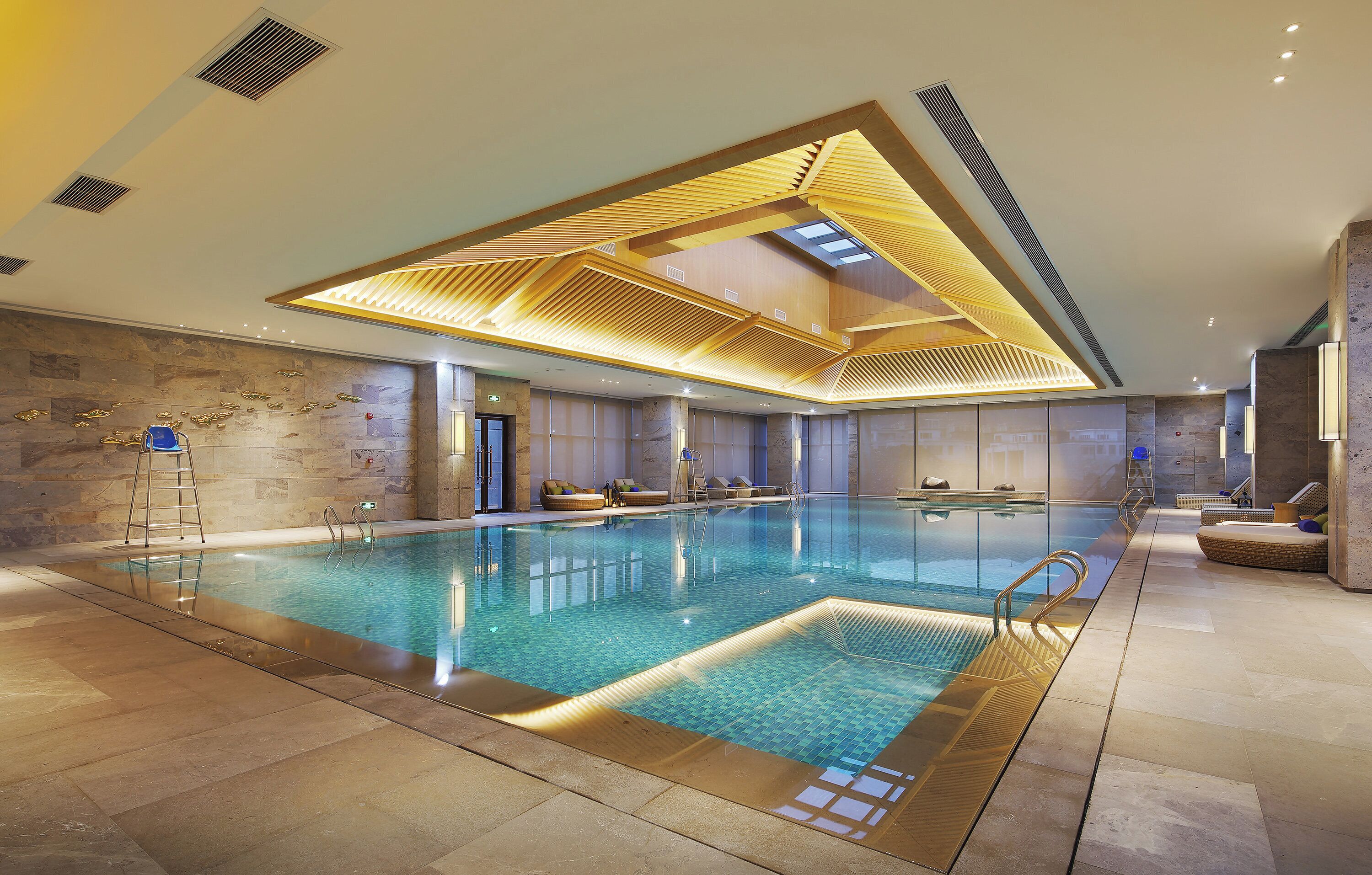 Indoor pool, open 7:30 AM to 10:00 PM, pool loungers
