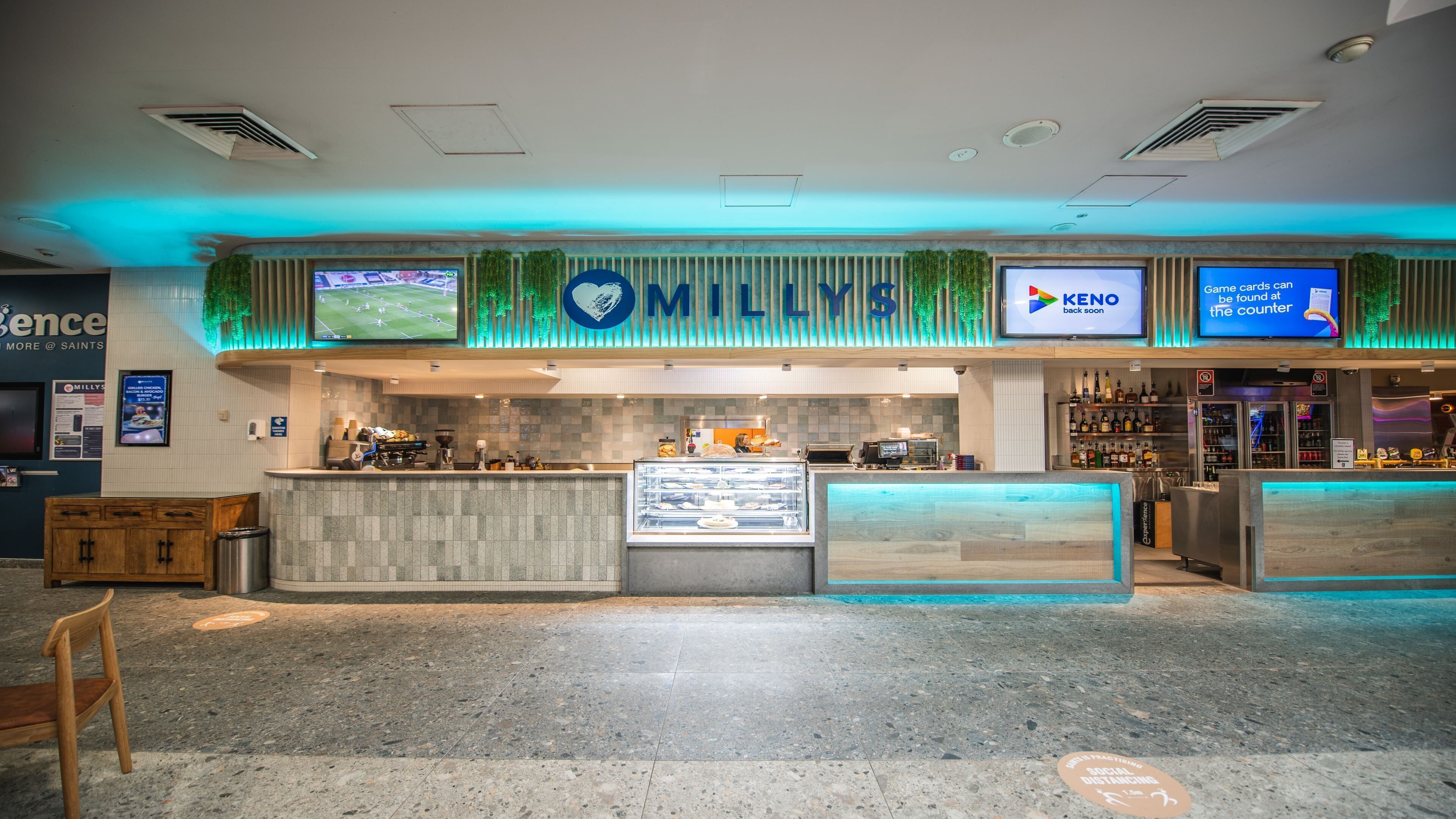 A restaurant with a counter, menu boards, and a sign for Keno.