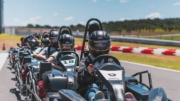 A line of go-karts on a race track.