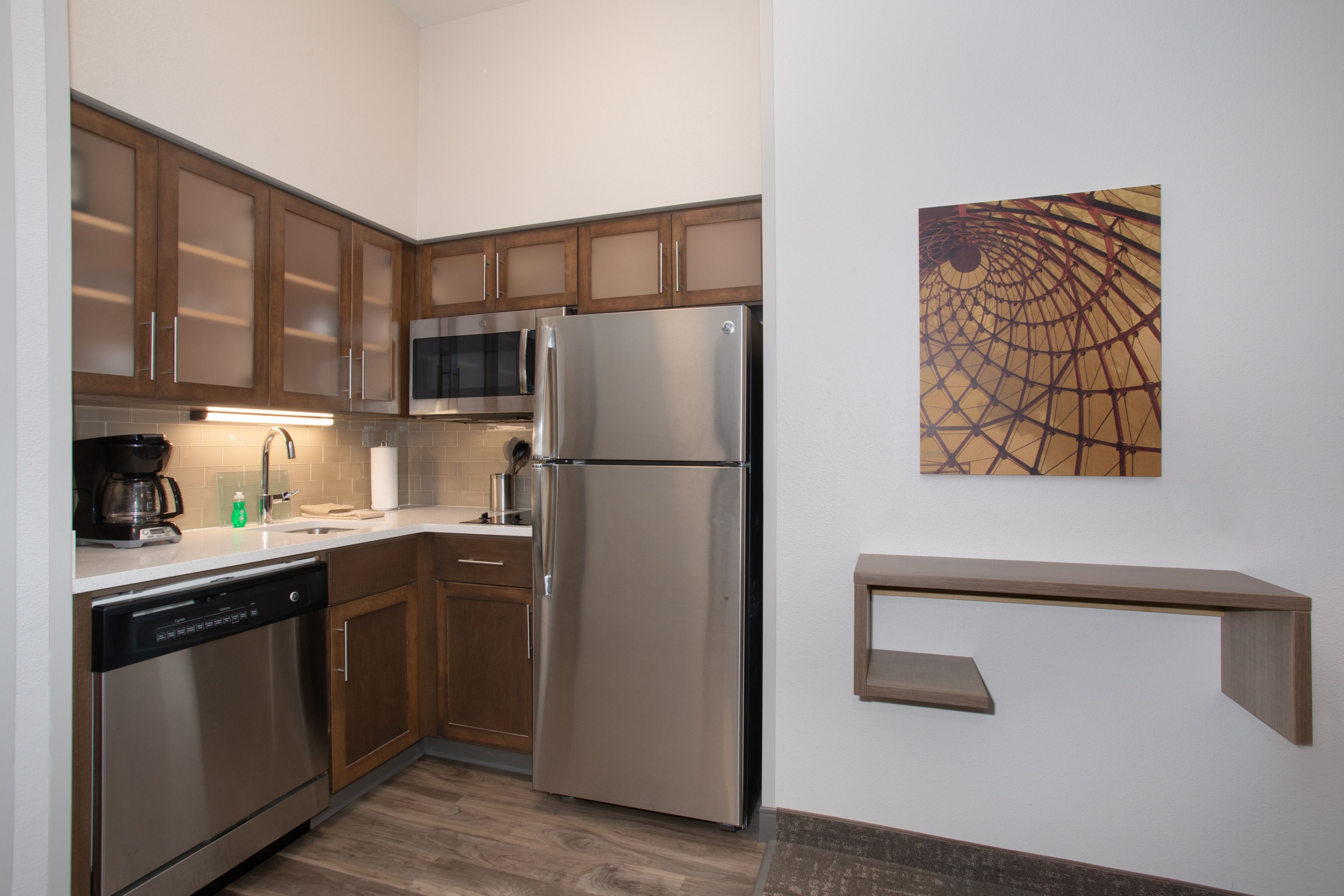 full-sized fridge, microwave, stovetop, dishwasher