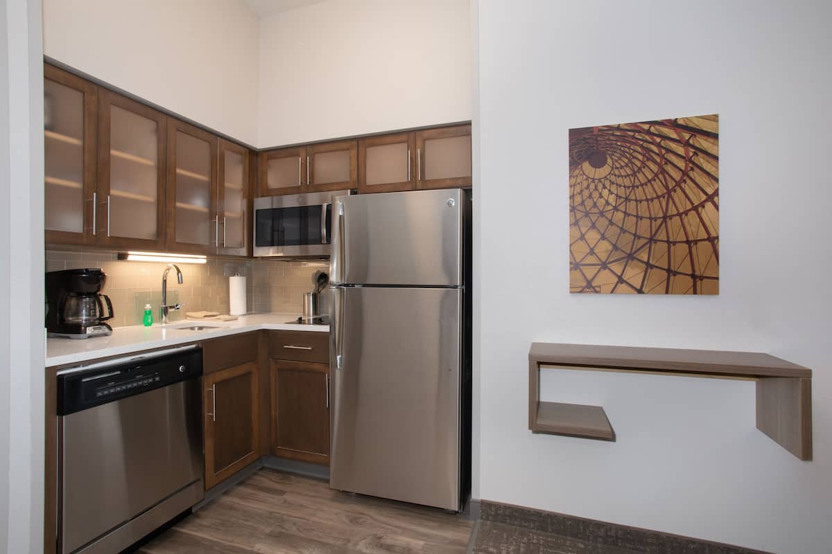 full-sized fridge, microwave, stovetop, dishwasher