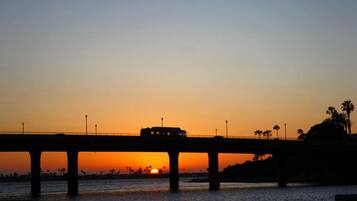 Beach nearby, white sand, beach umbrellas, beach towels