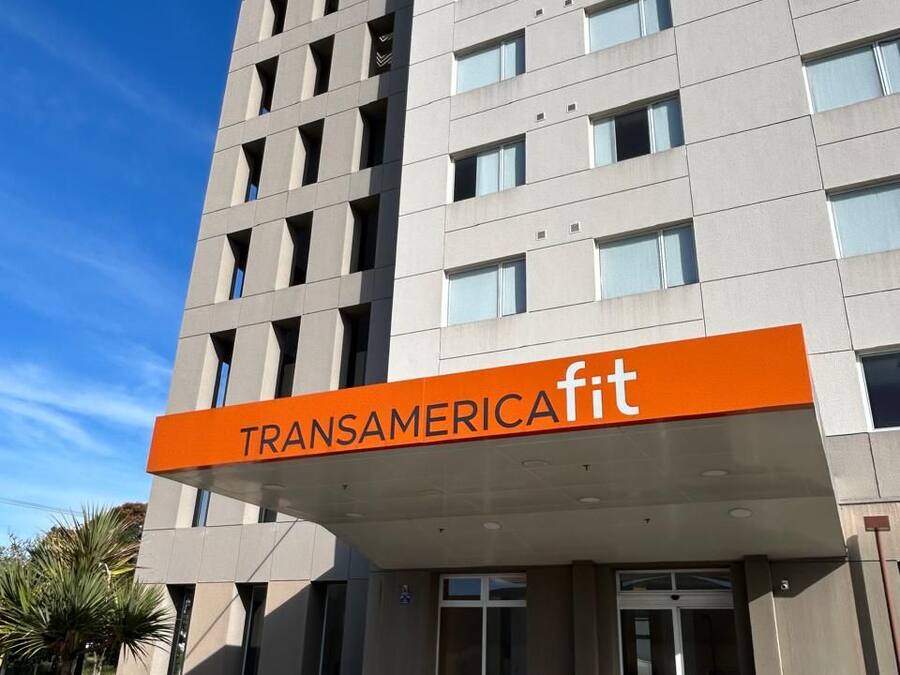 A modern building with a sign reading "TRANSAMERICAfit".