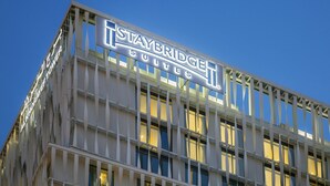 A building with a sign reading "Staybridge Suites."