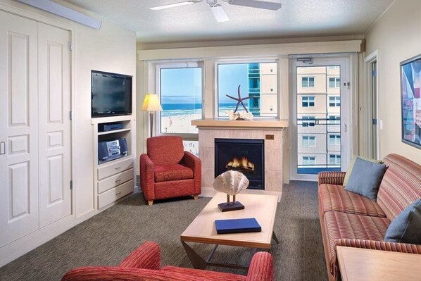 Télévision à écran plat, cheminée, films à la carte