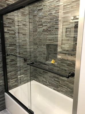 Combined shower/tub, hair dryer, towels, soap