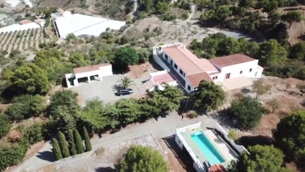 An aerial view of a property with a swimming pool, a two-story building, and surrounding greenery. - Villa with pool, breathtaking views, sleeps 11. Gualchos, near Castell   (Gualchos)