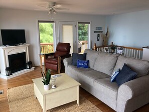 Smart TV, fireplace, table football, books