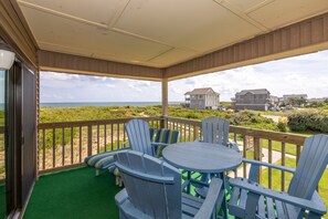 Outdoor dining - End Unit Oceanfront condo 2 min to beach 1.5 if you run THAT VIEW THOUGH!!! (Duck)