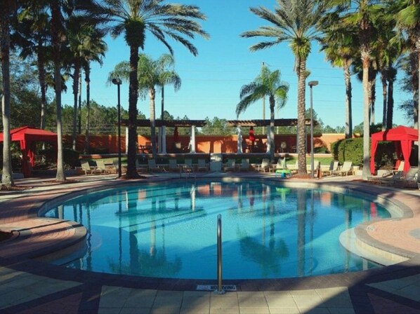 A heated pool, sun loungers