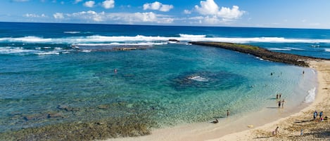 On the beach, sun loungers, beach towels