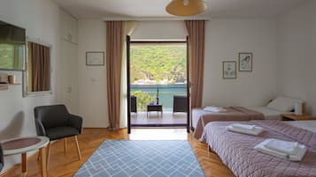 Apartment, Balcony, Sea View (1 Bedroom, 4 adults) | Desk, iron/ironing board, WiFi (free), bed sheets