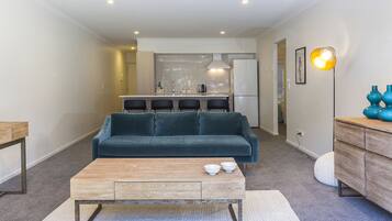 Central City Chic Apartment G04 | Living area | Flat-screen TV